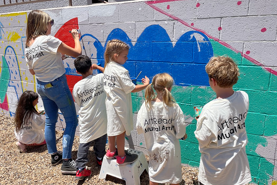 Kids of The Museum School painting a mural