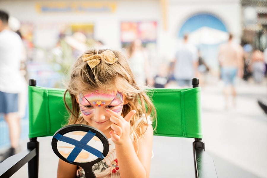 Kids celebrating fall at Belmont Park's beachfront amusement park