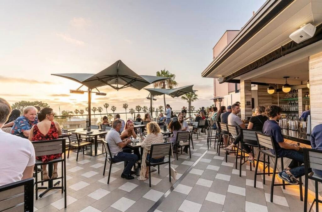 Birdseye rooftop bar full of diners