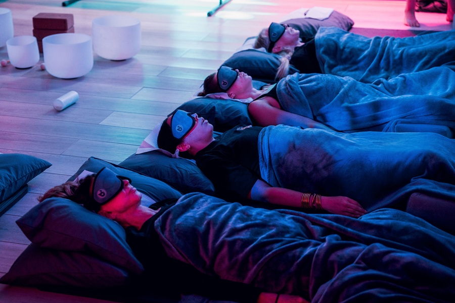 Guests resetting their nervous systems during a guided breathwork class at Breathe Degrees