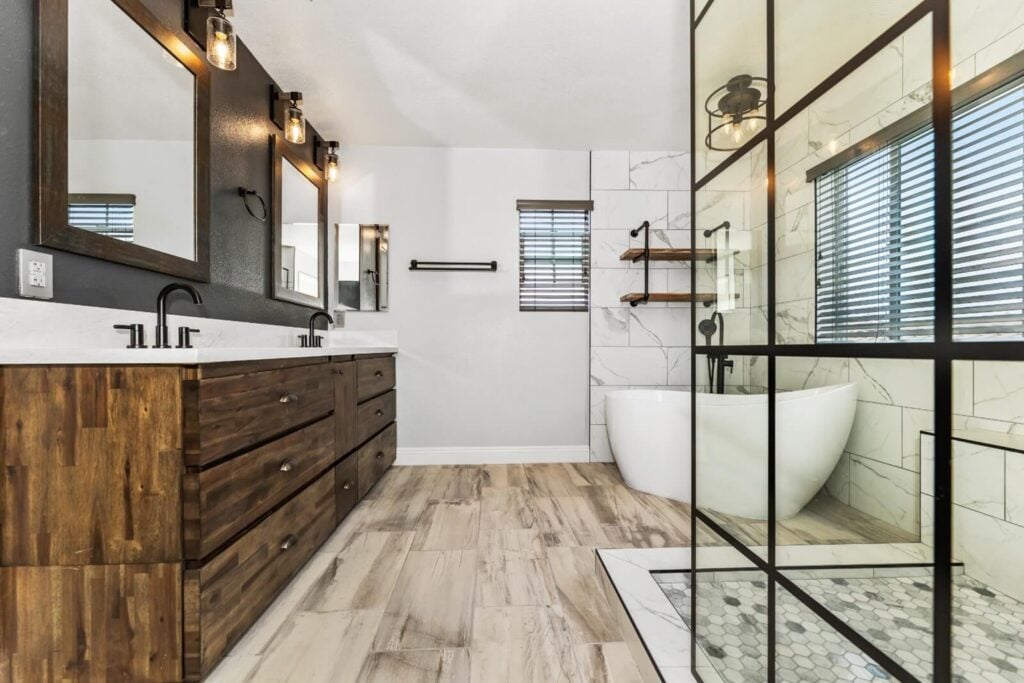 Elements modern bathroom with double vanity, and freestanding tub