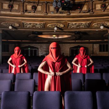 three women in sexy red robes