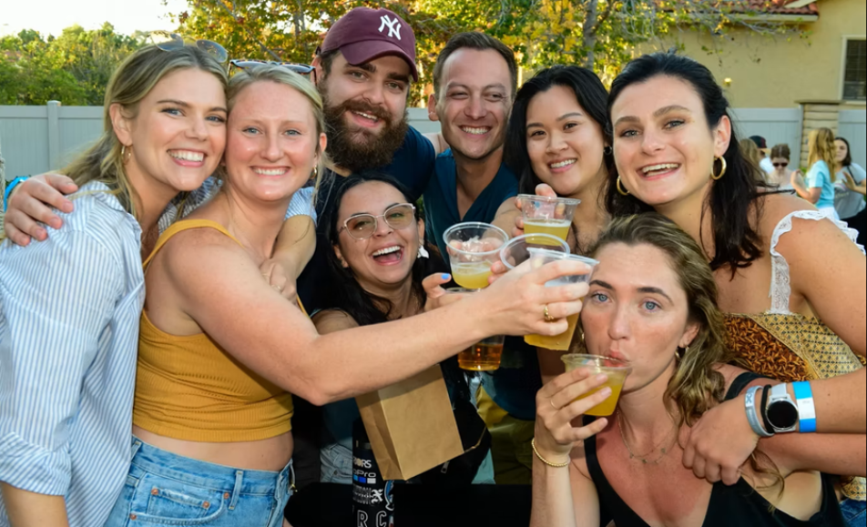 Clinking glasses at Encinitas Oktoberfest