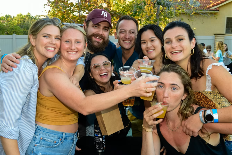 Clinking glasses at Encinitas Oktoberfest