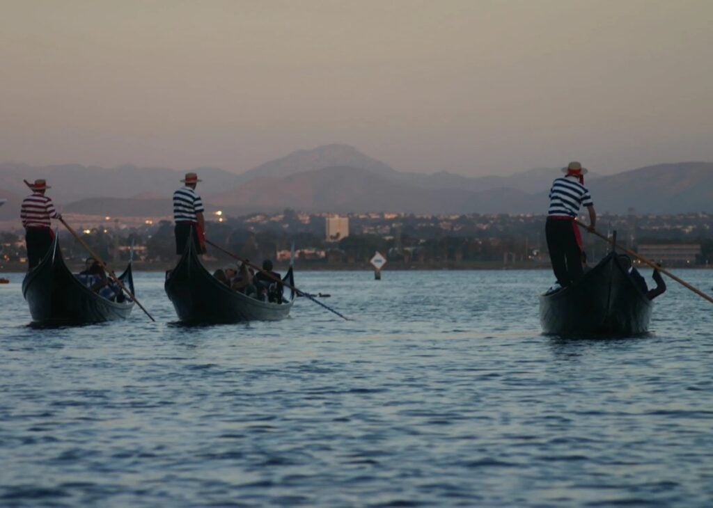 Sunset glowing over the Coronado Cays canals during a Gondola Company cruise
