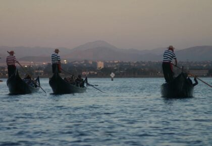 Sunset glowing over the Coronado Cays canals during a Gondola Company cruise