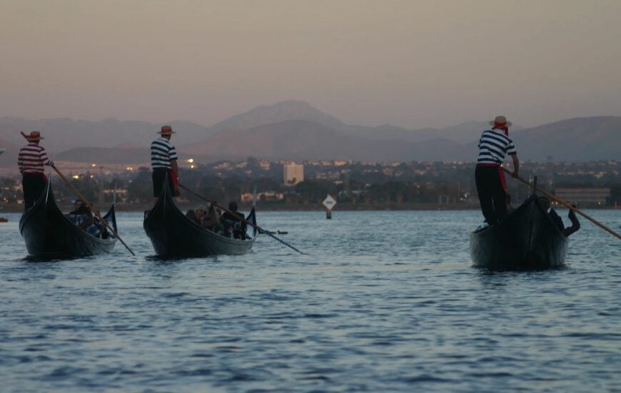 Sunset glowing over the Coronado Cays canals during a Gondola Company cruise