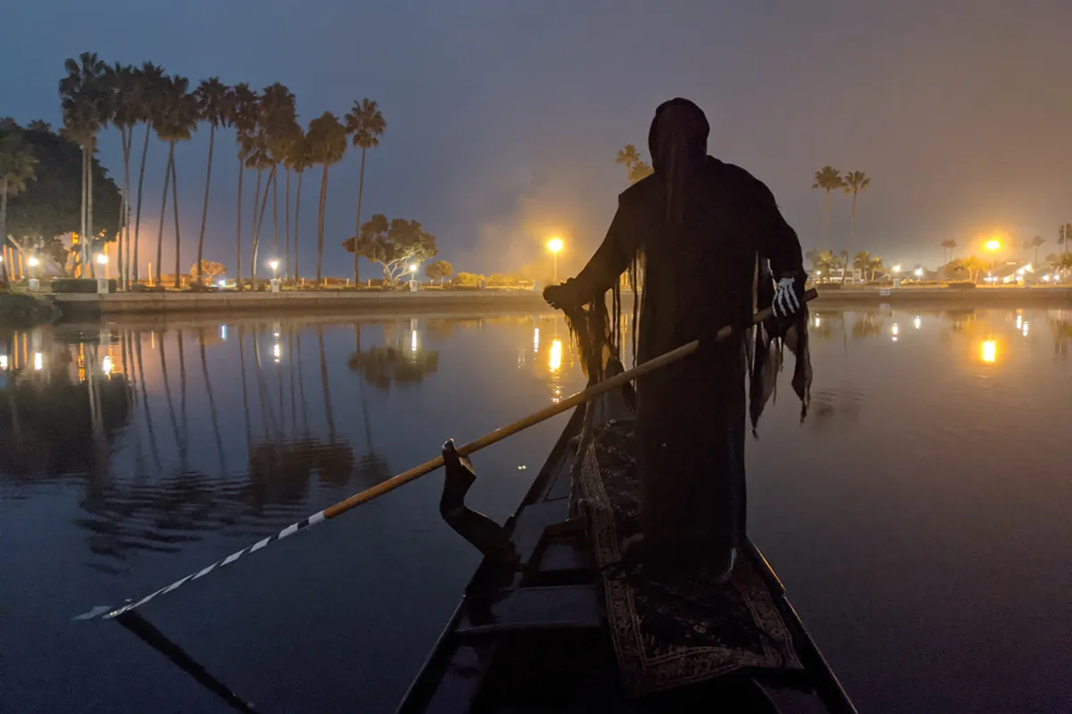 Phantom gondoliers rowing through A Haunting in Venice Cruise