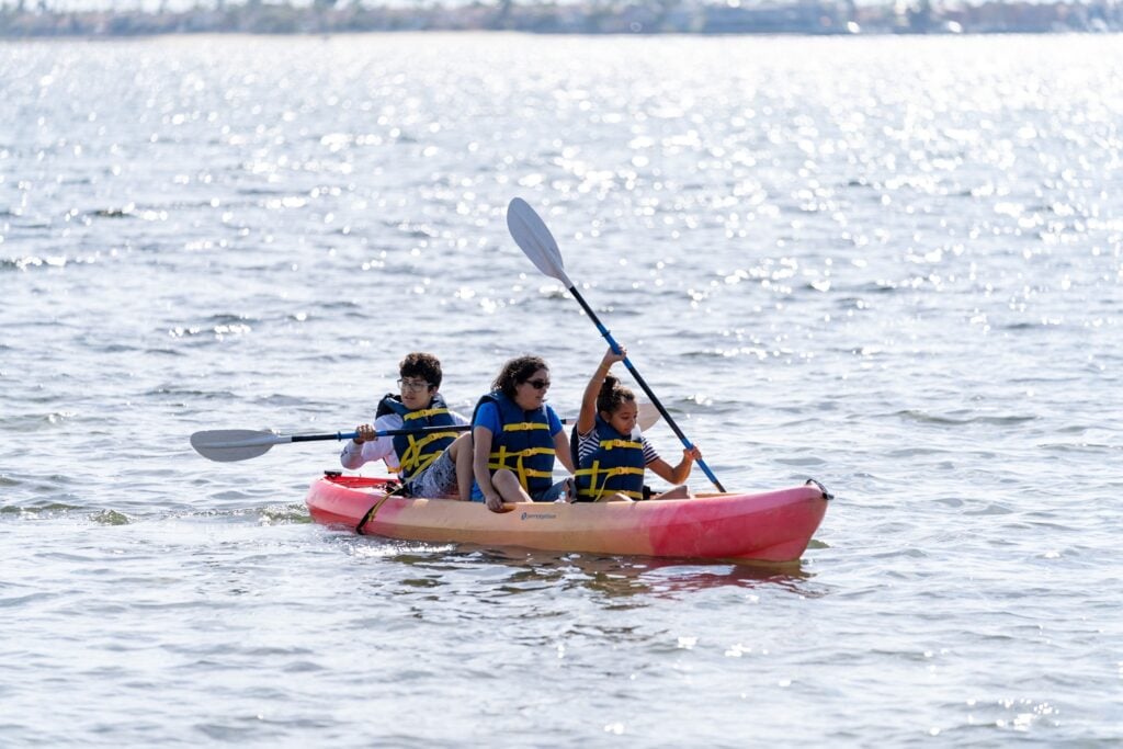 three people kayaking