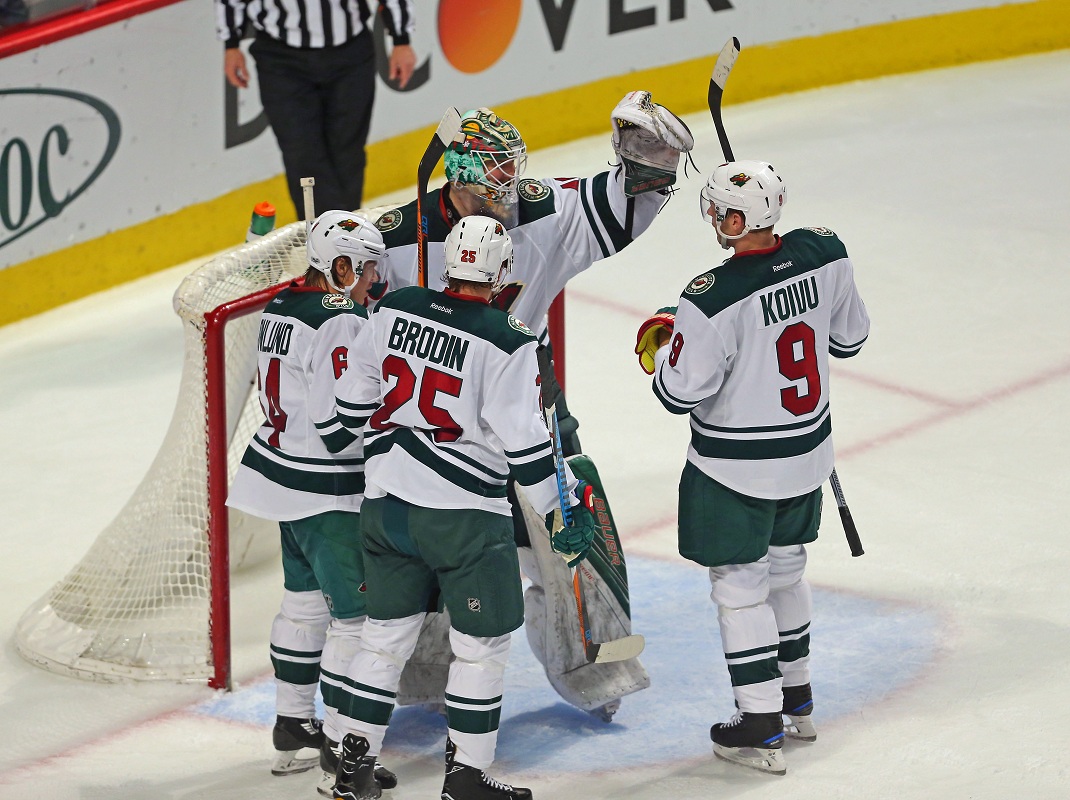 Jan 15, 2017; Chicago, IL, USA; Minnesota Wild goalie Devan Dubnyk (40) and his teammates celebrate their victory following the third period against the Chicago Blackhawks at the United Center. Minnesota won 3-2. Mandatory Credit: Dennis Wierzbicki-USA TODAY Sports