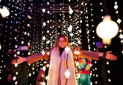 woman surrounded by lights