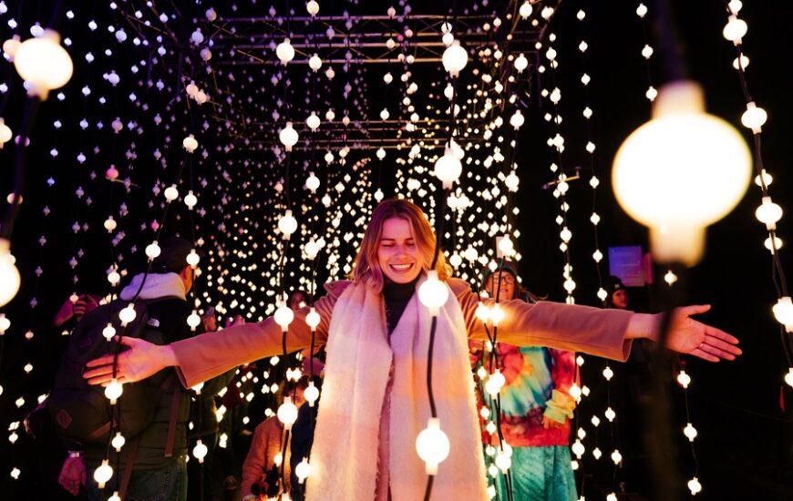 woman surrounded by lights