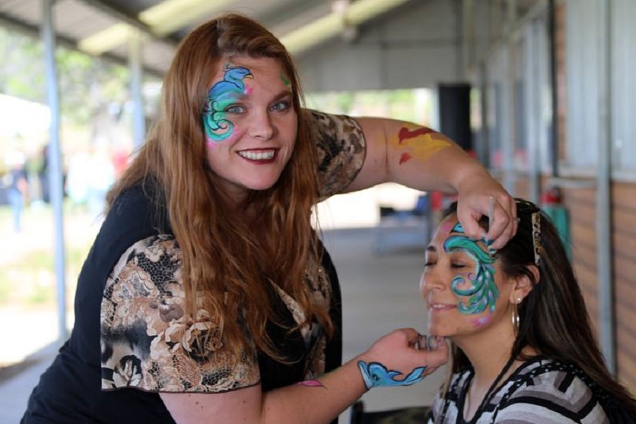two women with face paintings