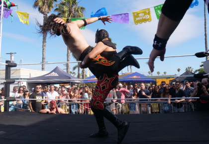 two people wrestling inside a ring