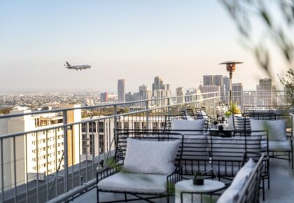 Mister A rooftop bar with an airplane passing by in the horizon