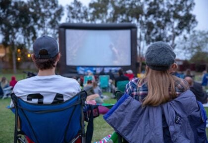 A festive crowd enjoying Movie in the Park