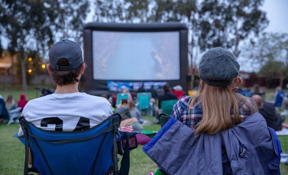A festive crowd enjoying Movie in the Park