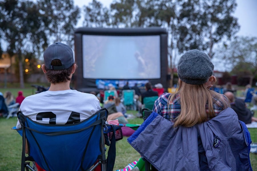 A festive crowd enjoying Movie in the Park