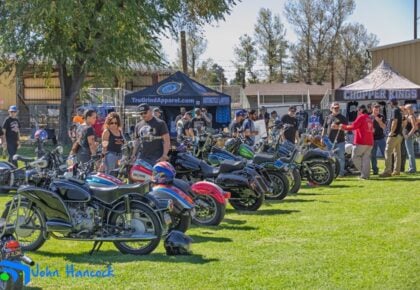 Custom motorcycles lined up and gleaming at the Ramona Rally Bike Show