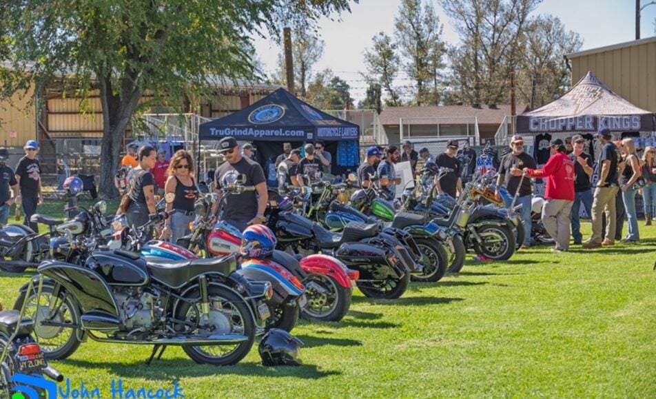 Custom motorcycles lined up and gleaming at the Ramona Rally Bike Show