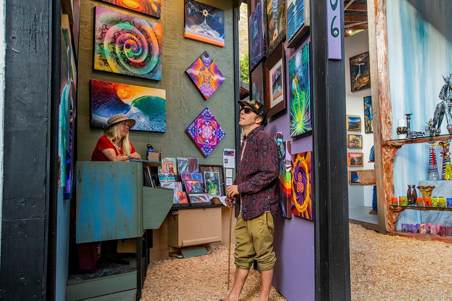 Local artist displaying handcrafted work at the Sawdust Art Festival