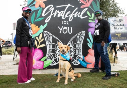 Dogs and owners at the Salute to Paws 5K and Gratitude Festival