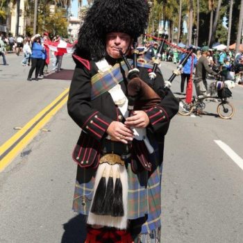 bagpiper joining a parade on St. Patrick's Day