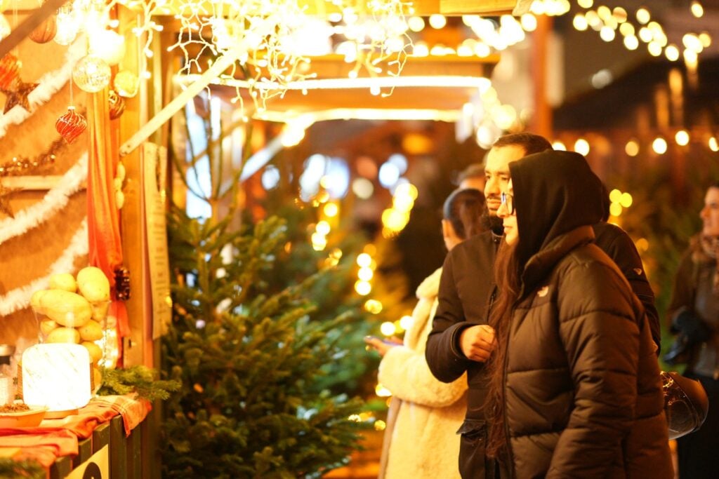 Friends sip, shop, and soak up the holiday magic at Swiss Winter Village San Diego