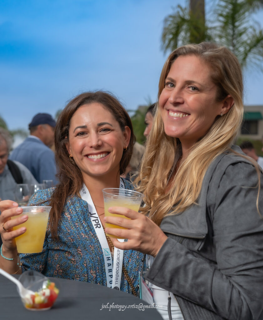 two women with drinks in hand