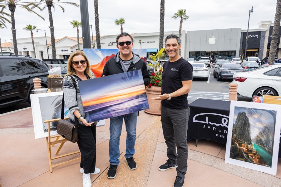 Artists showcasing their work at the Fall Art & Wine Walk