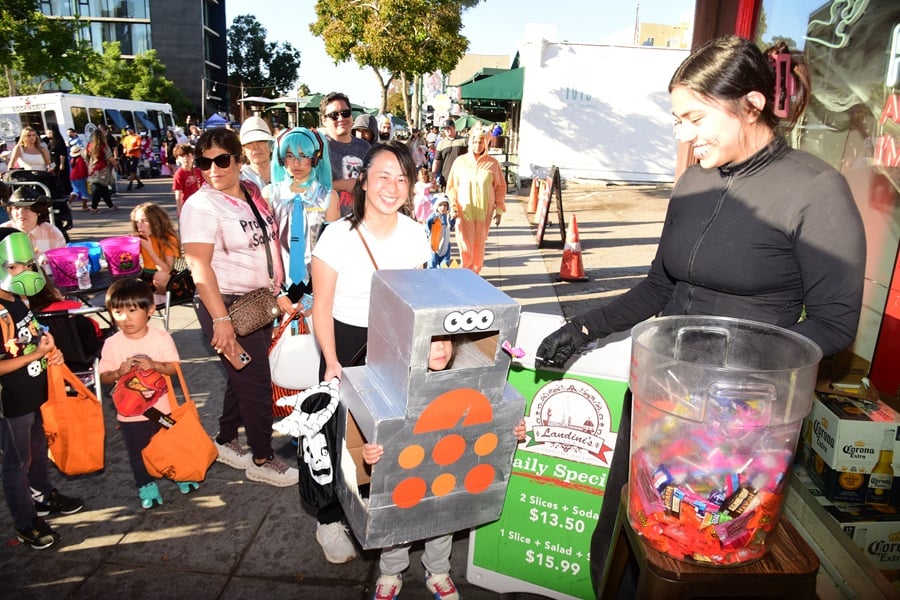 Kids trick-or-treating in the crowd at Trick-or-Treat on India Street