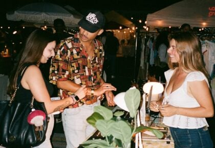 Shoppers browse local vendors at the Waves & Makers night market