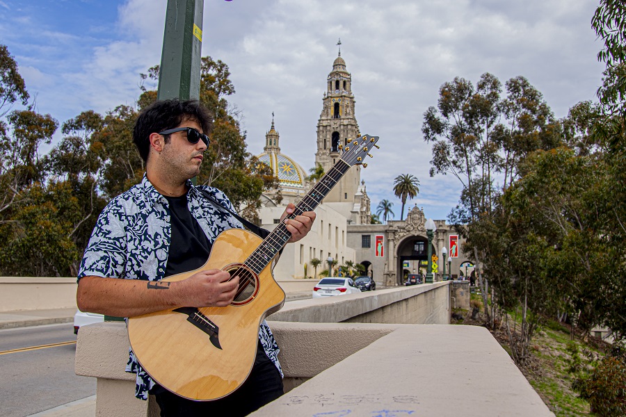 guy with a guitar in balboa park