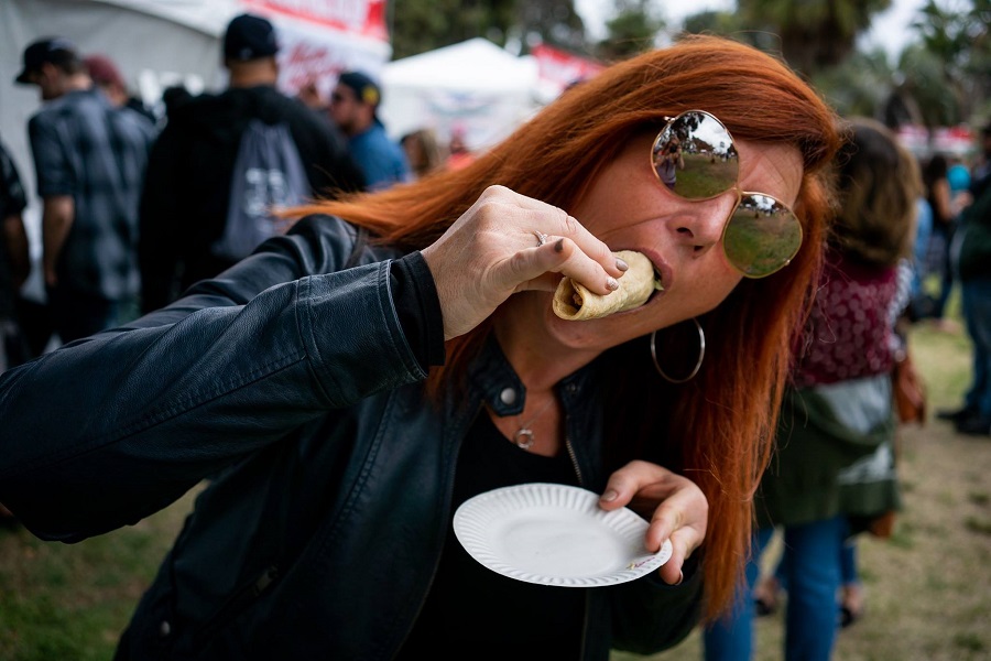 woman eating a taco