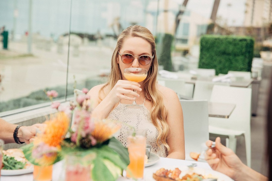woman eating brunch at tower23 hotel